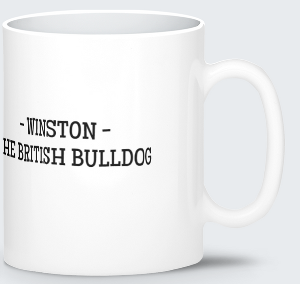 A white ceramic mug featuring a printed illustration of a bulldog wearing a Union Jack shirt and top hat, set against a festive British-themed background with bunting, flags, and confetti.