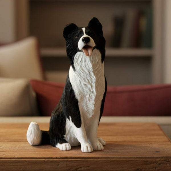 Black and white Border Collie sitting sculpture