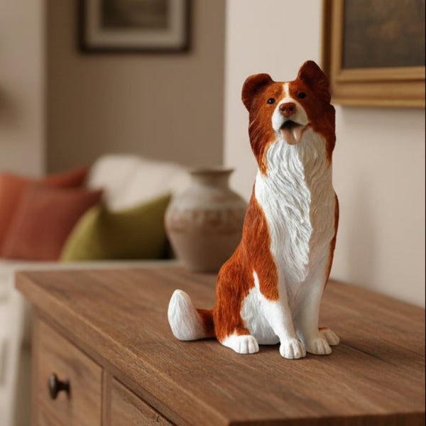 Tan coloured Border Collie sitting sculpture